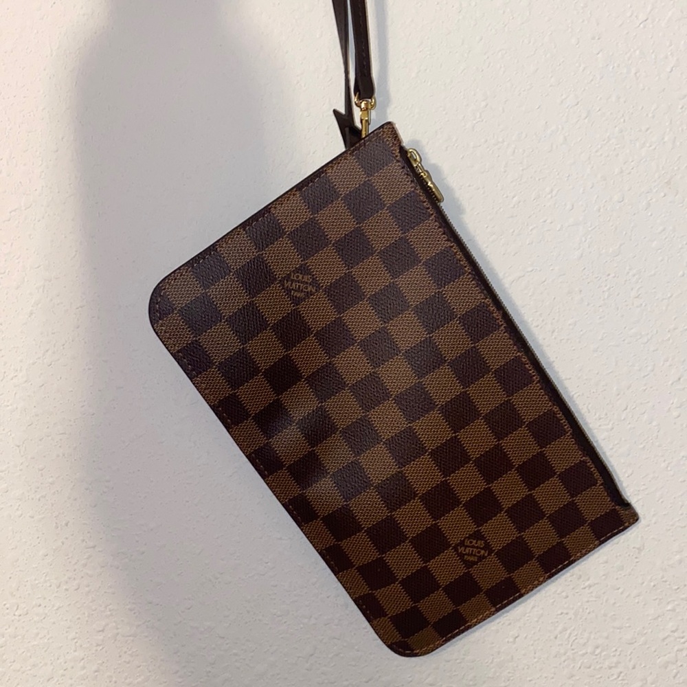 Slightly used authentic Louis V wristlet!